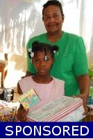 Founder of the Yolanda Thervil Foundation distributing the Make Jesus Smile United Caribbean Trust shoeboxes in Haiti